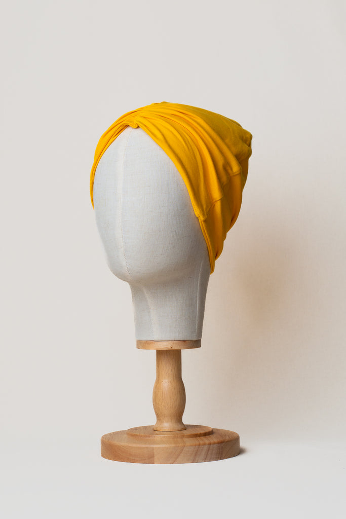 Turbante amarillo de Happy Belly  de algodón orgánico