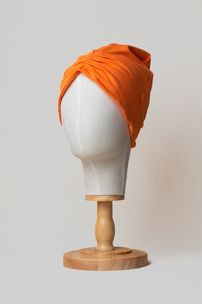 Turbante color naranja en algodón orgánico de Happy Belly
